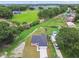 Stunning aerial shot of the home, highlighting its well-manicured lawn, spacious driveway, and peaceful neighborhood setting at 4189 Homestead Dr, Lakeland, FL 33810