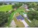 An aerial shot captures this single Gathering residence, nicely manicured yard, and the neighborhood's serene beauty at 4189 Homestead Dr, Lakeland, FL 33810