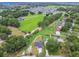 An aerial view of the home showcasing the surrounding neighborhood and green space at 4189 Homestead Dr, Lakeland, FL 33810
