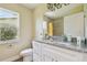 Updated bathroom features granite countertops, a modern vanity, and a shower/tub combo at 4189 Homestead Dr, Lakeland, FL 33810