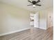 Bedroom featuring wood-look flooring and an open doorway to a kitchen at 4189 Homestead Dr, Lakeland, FL 33810