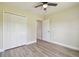Bedroom with spacious closet and wood-look flooring throughout at 4189 Homestead Dr, Lakeland, FL 33810