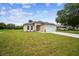 Inviting single-story home showcasing a well-kept lawn and a convenient two-car garage for parking at 4189 Homestead Dr, Lakeland, FL 33810