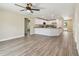 Open-concept living space featuring wood-look floors, recessed lighting, and a modern ceiling fan at 4189 Homestead Dr, Lakeland, FL 33810