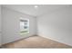 Neutral bedroom with carpet, a window for natural light, and electrical outlets at 431 Caribbean Ct, Poinciana, FL 34759