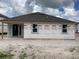 New construction home with a covered patio and windows overlooking the backyard at 2244 Broadbrook Drive, St Cloud, FL 34771