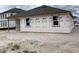 New construction home with a spacious backyard and builder paper on the exterior walls at 2244 Broadbrook Drive, St Cloud, FL 34771