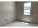 Unfinished bedroom with new windows and natural light, offering potential for personalization and custom design at 2244 Broadbrook Drive, St Cloud, FL 34771