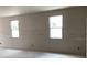 Bright unfinished living room featuring newly installed windows with natural light and potential for custom design at 2244 Broadbrook Drive, St Cloud, FL 34771