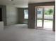Spacious unfinished living room featuring French doors leading outside, with potential for custom design at 2244 Broadbrook Drive, St Cloud, FL 34771