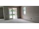 Bright unfinished living room featuring French doors leading outside and potential for custom design at 2244 Broadbrook Drive, St Cloud, FL 34771