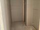 Unfinished walk-in closet features drywall and concrete flooring ready for customization and personalization at 2244 Broadbrook Drive, St Cloud, FL 34771