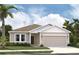 Charming single-story home with attached garage, landscaped yard, and neutral siding at 2373 Broadbrook Drive, St Cloud, FL 34771