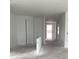 Unfinished living room with open concept floor plan and neutral walls at 2373 Broadbrook Drive, St Cloud, FL 34771