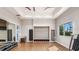 Bright fitness center features wood floors, mirrored wall, storage bench and large windows with a view at 852 Arbor Green Trl, St Cloud, FL 34771