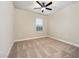 Neutral bedroom with large window, carpeted floors, and ample natural light at 7728 Somersworth Dr, Kissimmee, FL 34747