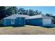 Newly built home featuring a two-car garage and well-manicured lawn at 9320 Se 163Rd St, Summerfield, FL 34491