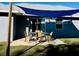 Relaxing patio with shade cover, perfect for outdoor dining at 9320 Se 163Rd St, Summerfield, FL 34491