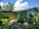 Newly painted house exterior with yellow door at 422 22Nd Sw St, Winter Haven, FL 33880