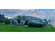 View of the lawn and tropical landscaping of this lovely home at 2514 Sage Dr, Kissimmee, FL 34758