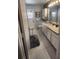 Well-lit bathroom featuring a vanity with sink, mirror, and ample storage space at 2514 Sage Dr, Kissimmee, FL 34758