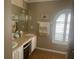 Well-lit bathroom with a double vanity, decorative window, and modern fixtures at 2514 Sage Dr, Kissimmee, FL 34758