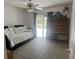 Bright bedroom with a daybed, desk, and sliding glass doors leading to outdoor area at 2514 Sage Dr, Kissimmee, FL 34758