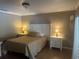 Cozy bedroom with neutral tones, a comfortable bed, and classic nightstands with lamps at 2514 Sage Dr, Kissimmee, FL 34758