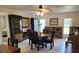 Elegant dining room with a round table, comfortable chairs, and ample natural light at 2514 Sage Dr, Kissimmee, FL 34758