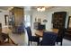 Cozy dining area featuring a round table and chairs, with access to the kitchen and an outdoor view at 2514 Sage Dr, Kissimmee, FL 34758