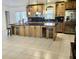 Spacious kitchen featuring granite countertops, stainless steel appliances, and ample storage space at 2514 Sage Dr, Kissimmee, FL 34758
