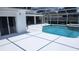 Scenic view of a clear blue pool with a spa and a screened enclosure for year-round enjoyment at 2514 Sage Dr, Kissimmee, FL 34758