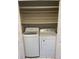 Convenient laundry closet with a white front-loading washing machine and dryer at 2928 Lake Pineloch Blvd # 17-26, Orlando, FL 32806