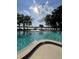 Beautiful community pool with ample seating overlooking the lake at 2928 Lake Pineloch Blvd # 17-26, Orlando, FL 32806