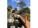 Scenic water feature with a bridge and lush landscaping complements this beautiful property at 2928 Lake Pineloch Blvd # 17-26, Orlando, FL 32806