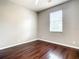 Bedroom with hardwood flooring and a window at 319 Ravenshill Way, Deland, FL 32724