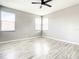 Bedroom with light wood flooring and a ceiling fan at 319 Ravenshill Way, Deland, FL 32724