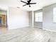 Large bedroom featuring light wood floors, a ceiling fan and neutral paint at 319 Ravenshill Way, Deland, FL 32724