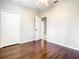 Cozy bedroom with wood floors, ceiling fan and closet at 319 Ravenshill Way, Deland, FL 32724