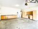 Spacious garage with ample storage cabinets and a utility sink, perfect for projects and organization at 319 Ravenshill Way, Deland, FL 32724