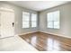 Bright living room with ample natural light and hard surface flooring at 319 Ravenshill Way, Deland, FL 32724