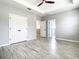 Primary bedroom with ensuite bathroom and ceiling fan at 319 Ravenshill Way, Deland, FL 32724