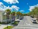 Street view of charming shops and offices with lush landscaping creating an inviting and vibrant community atmosphere at 319 Ravenshill Way, Deland, FL 32724