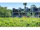 Modern condo building with lush landscaping at 520 S Peninsula Ave # 2D7, New Smyrna Beach, FL 32169