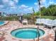 Community hot tub with surrounding patio furniture at 520 S Peninsula Ave # 2D7, New Smyrna Beach, FL 32169