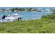 Scenic waterfront view with boats and lush vegetation at 520 S Peninsula Ave # 2D7, New Smyrna Beach, FL 32169