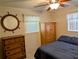 Nautical themed bedroom with a comfy bed and lots of storage space at 1628 Paradise Ln, Astor, FL 32102