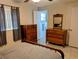 Comfortable bedroom with matching dressers and nice natural light at 1628 Paradise Ln, Astor, FL 32102
