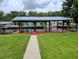 Waterfront property boasts a large covered dock, perfect for outdoor entertaining and enjoying the serene lake views at 1628 Paradise Ln, Astor, FL 32102