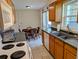 Efficient kitchen with ample counter space and views into the dining area at 1628 Paradise Ln, Astor, FL 32102